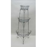 A LATE 19TH/EARLY 20TH CENTURY PAINTED WIREWORK THREE TIER DEMI-LUNE PLANT STAND, 146cm high