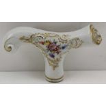 A MEISSEN PORCELAIN PARASOL HANDLE, of scroll form with hand painted floral decoration, blue cross