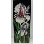 A WHITE FLAG IRIS with purple, tube lined and hand-painted pottery panel, 39.5cm x 15cm