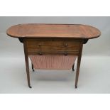 A 19TH CENTURY MAHOGANY FINISHED WORK TABLE having twin flap top with lift-up action revealing boxed