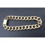 A 9ct GOLD FLATTENED CURB LINK BRACELET, 32.3g