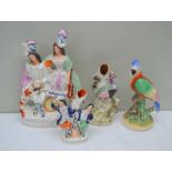 FOUR PIECES OF 19TH CENTURY STAFFORDSHIRE POTTERY to include two figural groups and two perched