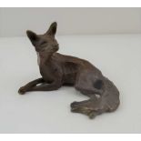 MICHAEL STOREY A LATE 20TH CENTURY BRONZE RECLINING FOX, brown patinated finish, signed, 5.5cm high