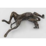 A 20TH CENTURY CAST BRONZE LONG DOG, lying on back pose, indistinctly signed, 13.5cm long