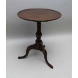 A 19TH CENTURY MAHOGANY SAUCER TOP OCCASIONAL TABLE, on turned stem and triform supports, 53cm in