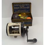 A COLLECTION OF FLOATS, REELS & LURES in old tin and a MITCHELL "ORCA" 45BT SEA FISHING REEL with