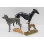 A POTTERY GREYHOUND, 20cm high together with; a rough coated painted resin long dog, a 19th