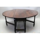 A LATE 18TH CENTURY OAK & ELM OVAL TWIN FLAP GATELEG TABLE, with opposing cutlery drawers, supported