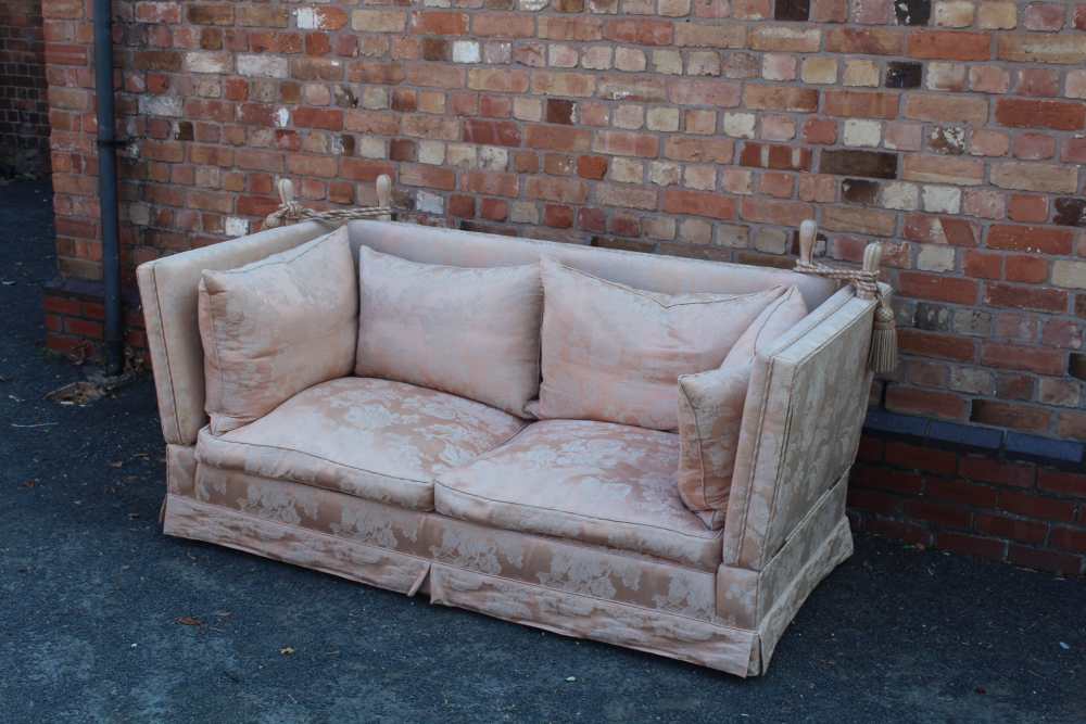 A KNOLL DESIGN SOFA, in pink patterned fabric, with loose cushions and ties, 196cm wide