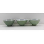 THREE CHINESE PORCELAIN RICE BOWLS, celadon glaze, transfer printed blue character marks to base,