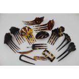 A COLLECTION OF FOURTEEN FAUX TORTOISESHELL SPANISH DESIGN HAIR COMBS