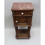 A LATE 19TH CENTURY FRENCH WALNUT MARBLE TOPPED BEDSIDE POT CUPBOARD having single drawer, over