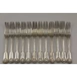 CHAWNER & CO. A SET OF TWELVE SILVER DINNER FORKS, fiddle & shell handles, London 1860, combined