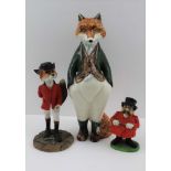 A POTTERY FOX in a standing pose, green jacket, paws in pockets, 24cm high, together with a '