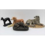 A 'BORDER FINE ARTS' PAINTED RESIN RECLINING WOLF HOUND, together with; a bronze effect reclining