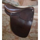 A LEATHER PONY SHOW SADDLE with straight flaps, 15", (length of flaps from below stirrup bars, 12.