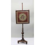 A 19TH CENTURY ROSEWOOD FRAMED POLE SCREEN, trafalgar base, the square glazed panel with floral