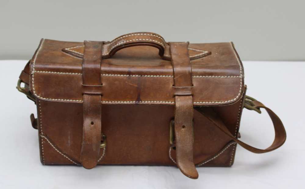 A LEATHER CARTRIDGE CASE, WITH HANDLE AND SHOULDER STRAP, 34cm wide
