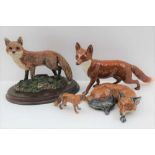 A BESWICK POTTERY STANDING FOX, factory marks to base, 13cm high together with; an 'Excalibur'