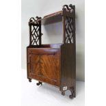 A REGENCY DESIGN MAHOGANY WALL CABINET, the top shelf having pierced sides, with cupboard to base,