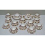 A ROYAL CROWN DERBY TEA SET, purple and gold acanthus leaf decoration, comprising; twelve cups,