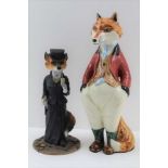 A POTTERY FOX, in a standing pose, dressed in a pink hunting jacket, 23cm high, together with a '