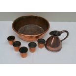 A 19TH CENTURY COPPER BOWL, 28cm diameter, a copper JUG and five copper TOTS