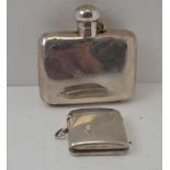 A SILVER HIP FLASK, with hinged twist cover, Birmingham 1922, together with a SILVER VESTA CASE,