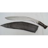 A GURKA KUKRI 13 1/2 INCH BLADE with wooden grips, in scabbard