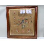 A 19TH CENTURY WOOLWORK SAMPLER, the centre piece an exotic bird with wings outstretched on a