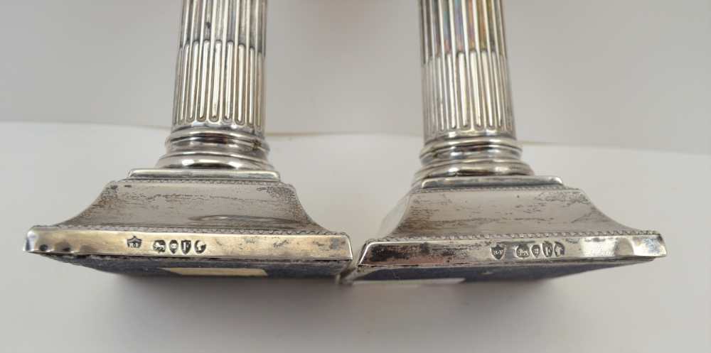 RUPERT FAVELL A PAIR OF VICTORIAN SILVER CANDLESTICKS of column design, on stepped square bases, - Image 2 of 3