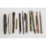 A COLLECTION OF "POCKET" ITEMS to include; eight pens/pencils, two cigar piercers and two folding