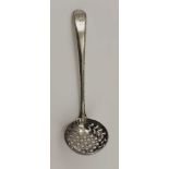 GEORGE SMITH III AN EARLY 18TH CENTURY SILVER SIFTING LADLE, having beaded edge handle, the terminal