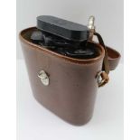 A PAIR OF BINOCULARS 10 x 40 "Habicht Swarovski Optik, Tirol", made in Austria, in brown leather