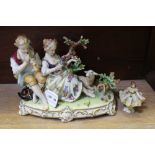A CONTINENTAL PORCELAIN FIGURE OF A BALLERINA, together with a figural group of shepherd and