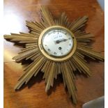 A MID CENTURY ELLIOTT BRANDED SUNBURST WALL CLOCK