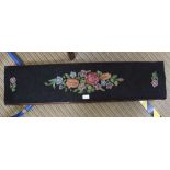 A LONG AND LOW FLORAL WOOLWORK PAD TOPPED FOOTSTOOL on scrolling knuckle feet