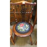 A LATE 19TH CENTURY PENNY SEATED WHEEL BACKED CHAIR, with floral woolwork pad seat