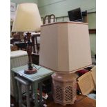 A PAINTED TABLE LAMP & SHADE together with a pierced POTTERY TABLE LAMP