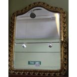 A SHIELD SHAPED FANCY PIERCED GILT FRAMED BEVELLED PLATE WALL MIRROR