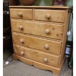 A 20TH CENTURY PINE BEDROOM CHEST OF FIVE DRAWERS with large turned knob handles