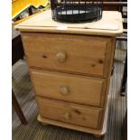 A MODERN PINE THREE DRAWER BEDSIDE CHEST