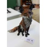 A 20TH CENTURY AUSTRIAN COLD PAINTED BRONZE SEATED FOX, impressed 'Austria' to the base, 13.5cm high