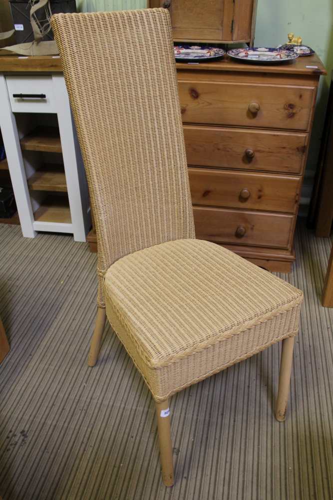 A LLOYD LOOM BRANDED WOVEN HIGH BACKED SINGLE CHAIR, finished in Rich Tea biscuit