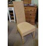 A LLOYD LOOM BRANDED WOVEN HIGH BACKED SINGLE CHAIR, finished in Rich Tea biscuit