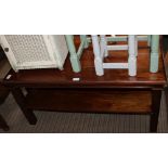 A GOOD QUALITY MAHOGANY FINISHED RECTANGULAR TOPPED COFFEE TABLE with solid magazine undertier