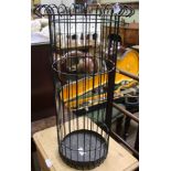 A WIREWORK STICK STAND with drip tray