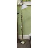 A MODERN BRUSHED BRASS FINISHED FLOOR STANDING LAMP with opaque glass shade