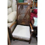 A BEECHWOOD ARMCHAIR with high bergere back