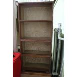 AN OAK FINISHED FREESTANDING OPEN FRONT SET OF SHELVES